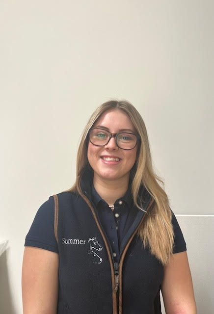 Summer smiling at the office.