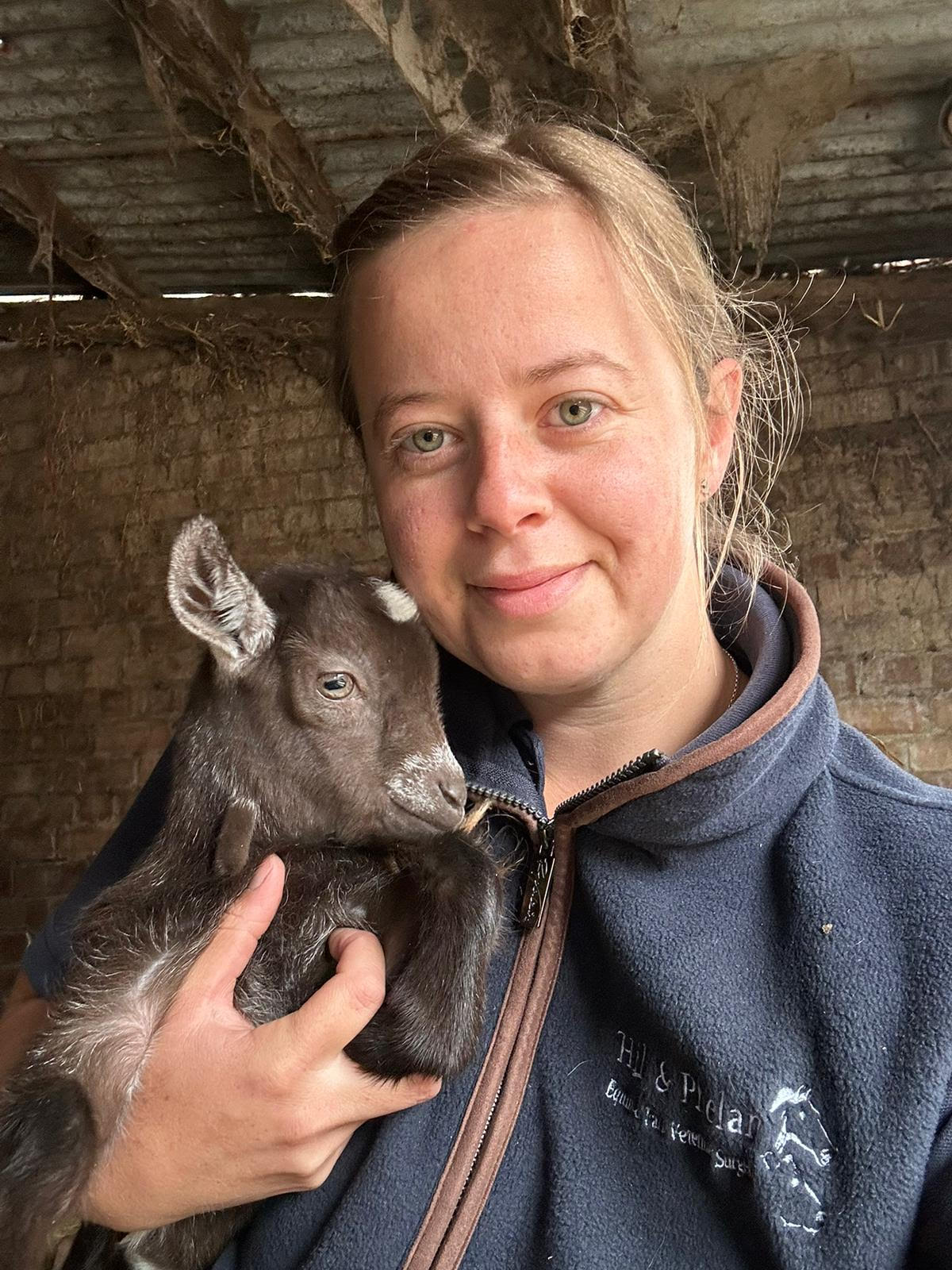 Naomi with a lamb Leo.