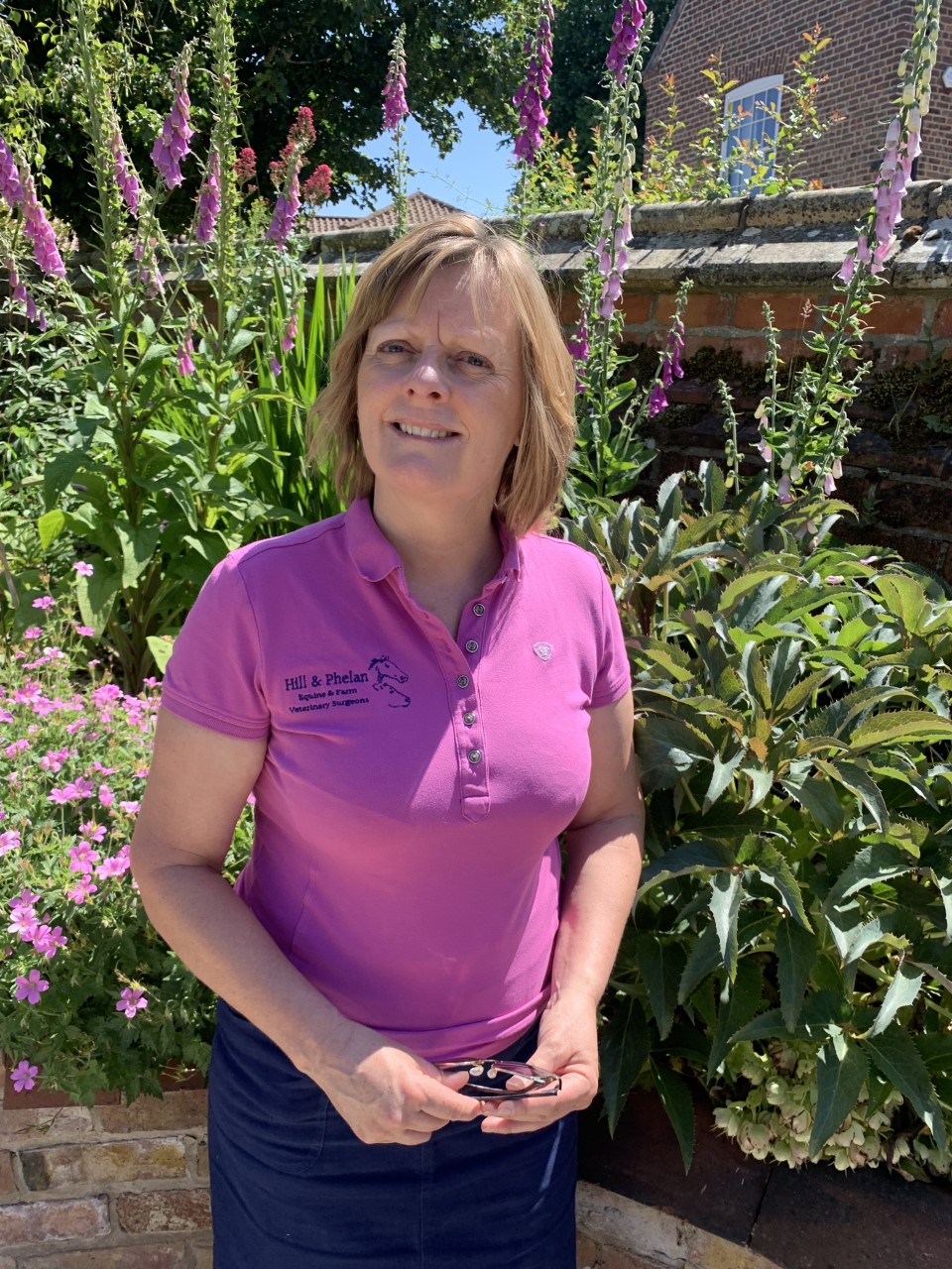 Nicki in her pink work top.